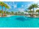 Refreshing community swimming pool with palm trees at 2174 Fleming Mist Pl, Kissimmee, FL 34747