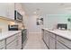 Sleek kitchen featuring stainless steel appliances and ample counter space at 2174 Fleming Mist Pl, Kissimmee, FL 34747