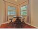 Cozy breakfast nook with a round table and three stools, bathed in natural light at 540 Francis Blvd, Lakeland, FL 33801