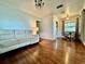 Open living room with hardwood floors, sectional sofa, and dining area view at 540 Francis Blvd, Lakeland, FL 33801