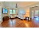Bright living room with hardwood floors, sectional sofa, and access to hallway at 540 Francis Blvd, Lakeland, FL 33801