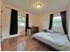 Well-lit bedroom with hardwood floors, a double bed, and ample closet space at 540 Francis Blvd, Lakeland, FL 33801