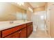 Bathroom with double vanity, large mirror, and a separate shower at 406 Tortosa Ct, Davenport, FL 33837