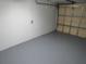 Spacious garage with painted floor and overhead door at 1196 N Florence Ave, Lakeland, FL 33805