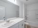 Clean bathroom, featuring a bathtub and white vanity at 2292 Cypress Creek St, Auburndale, FL 33823