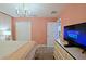 Spacious bedroom with a TV and dresser at 2857 Bookmark Dr, Kissimmee, FL 34746