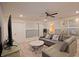 Bright loft area with sectional sofa and a large TV at 2857 Bookmark Dr, Kissimmee, FL 34746