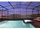 Night view of a relaxing pool and spa with lake view at 2857 Bookmark Dr, Kissimmee, FL 34746