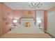 Bedroom with queen-size bed and soft pink color scheme at 2857 Bookmark Dr, Kissimmee, FL 34746