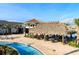 Tropical tiki bar and lounge chairs by the pool at 2857 Bookmark Dr, Kissimmee, FL 34746