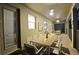 Covered patio with outdoor dining set and access to interior at 2857 Bookmark Dr, Kissimmee, FL 34746