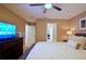 Bedroom with king-size bed and TV at 2857 Bookmark Dr, Kissimmee, FL 34746