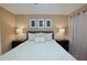 King-size bed, nightstands and decorative pillows at 2857 Bookmark Dr, Kissimmee, FL 34746