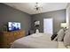 Comfortable bedroom with king-size bed and flat-screen TV at 2857 Bookmark Dr, Kissimmee, FL 34746