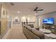 Open loft area with sectional sofa and access to bedrooms at 2857 Bookmark Dr, Kissimmee, FL 34746