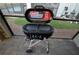 Black Coleman two-burner tabletop gas grill with side burner at 2857 Bookmark Dr, Kissimmee, FL 34746