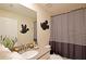 Mickey Mouse themed bathroom with shower and sink at 2857 Bookmark Dr, Kissimmee, FL 34746