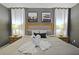 King-size bed, neutral tones and elegant decor in this bedroom at 2857 Bookmark Dr, Kissimmee, FL 34746