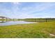 Serene lakefront view with lush green landscape at 2857 Bookmark Dr, Kissimmee, FL 34746