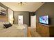 Spacious bedroom with king-size bed, TV, and ensuite bathroom access at 2857 Bookmark Dr, Kissimmee, FL 34746