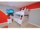 bedroom with bunk beds and red and grey decor at 2857 Bookmark Dr, Kissimmee, FL 34746