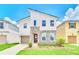 Two-story home with modern design and stone accents at 1959 Tropical Palms Cir, Kissimmee, FL 34747