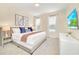 Bedroom with king-size bed and modern decor at 1959 Tropical Palms Cir, Kissimmee, FL 34747