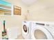 Laundry room with washer, dryer, and storage at 1959 Tropical Palms Cir, Kissimmee, FL 34747