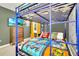 Star Wars themed bedroom with a bunk bed, dresser, and unique wall decor at 1959 Tropical Palms Cir, Kissimmee, FL 34747