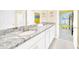Double vanity bathroom with granite countertop and modern design at 1959 Tropical Palms Cir, Kissimmee, FL 34747