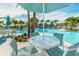 Relaxing poolside seating area with tables and umbrellas at 1959 Tropical Palms Cir, Kissimmee, FL 34747