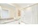 Bathroom with granite countertop, bathtub, and shower at 1959 Tropical Palms Cir, Kissimmee, FL 34747