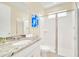 Bathroom with granite countertop and shower at 1959 Tropical Palms Cir, Kissimmee, FL 34747