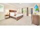 Main bedroom with king-size bed and large TV at 1959 Tropical Palms Cir, Kissimmee, FL 34747