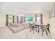 Spacious bonus room with large sectional sofa and a dining table at 1959 Tropical Palms Cir, Kissimmee, FL 34747
