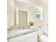 Clean bathroom with granite countertop, white vanity, and updated fixtures at 1959 Tropical Palms Cir, Kissimmee, FL 34747