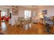 Dining area with glass table, wicker chairs, and access to balcony at 1 John Anderson Dr # 604, Ormond Beach, FL 32176