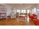Living room with hardwood floors, large windows, and comfortable seating at 1 John Anderson Dr # 604, Ormond Beach, FL 32176