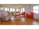 Living room with hardwood floors, large windows, and comfortable seating at 1 John Anderson Dr # 604, Ormond Beach, FL 32176