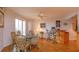 Dining area with glass table, wicker chairs, and access to balcony at 1 John Anderson Dr # 604, Ormond Beach, FL 32176