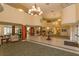 Elegant lobby with comfortable seating and grand chandelier at 1 John Anderson Dr # 604, Ormond Beach, FL 32176