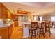 Bright kitchen with wood cabinets, breakfast bar, and ample counter space at 1 John Anderson Dr # 604, Ormond Beach, FL 32176