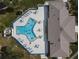 Community pool with surrounding lounge chairs and patio area at 241 Menlo Park Ave, Davenport, FL 33897