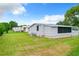 Single-story home with large backyard and screened patio at 241 Menlo Park Ave, Davenport, FL 33897