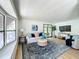 Living room with large windows and comfy seating at 241 Menlo Park Ave, Davenport, FL 33897