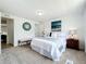 Bright bedroom with a queen bed and modern decor at 241 Menlo Park Ave, Davenport, FL 33897