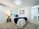 Second bedroom with a full-size bed and neutral decor at 241 Menlo Park Ave, Davenport, FL 33897