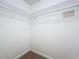 Walk-in closet with wire shelving; great for storage at 241 Menlo Park Ave, Davenport, FL 33897