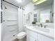 Bright bathroom with shower, toilet and vanity with white cabinets at 241 Menlo Park Ave, Davenport, FL 33897