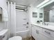 Clean bathroom with updated vanity and bathtub at 241 Menlo Park Ave, Davenport, FL 33897